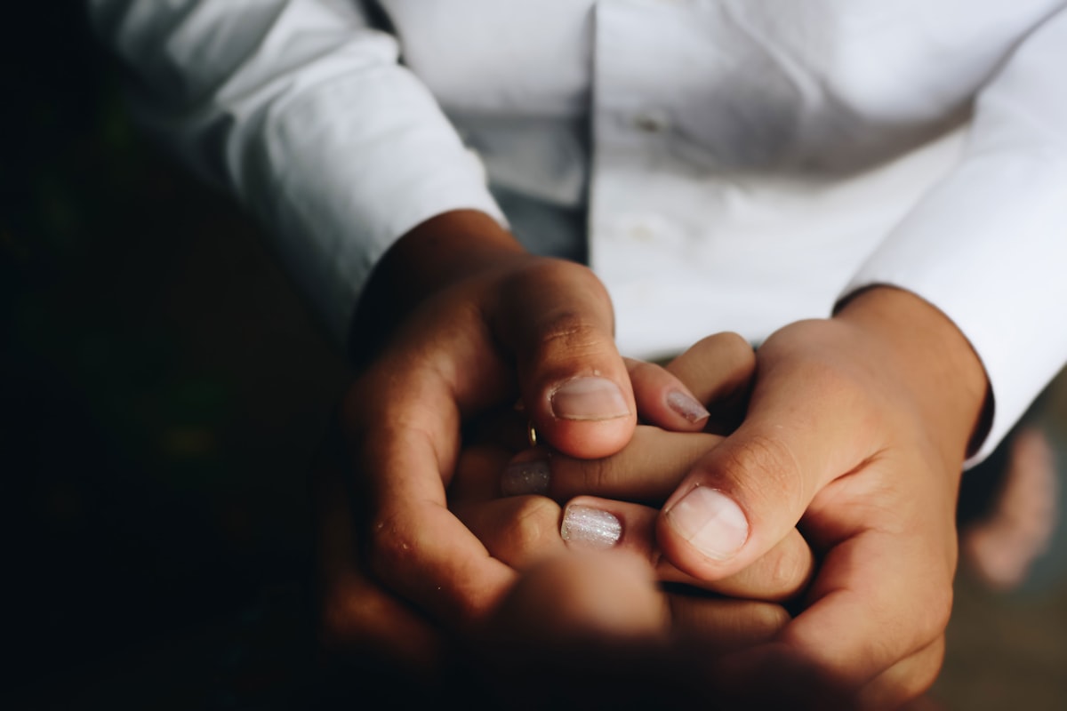 Gentle lymphatic massage strokes on a client’s arm